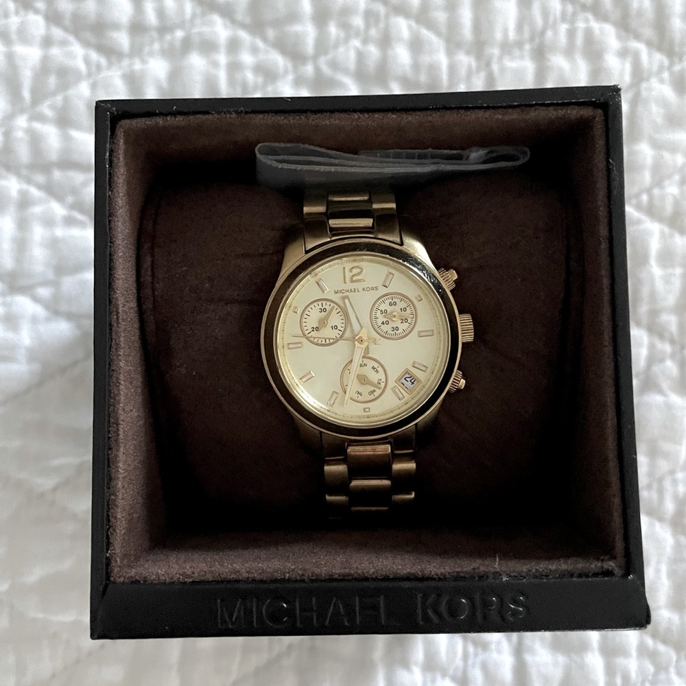 Womens Michael Kors gold watch